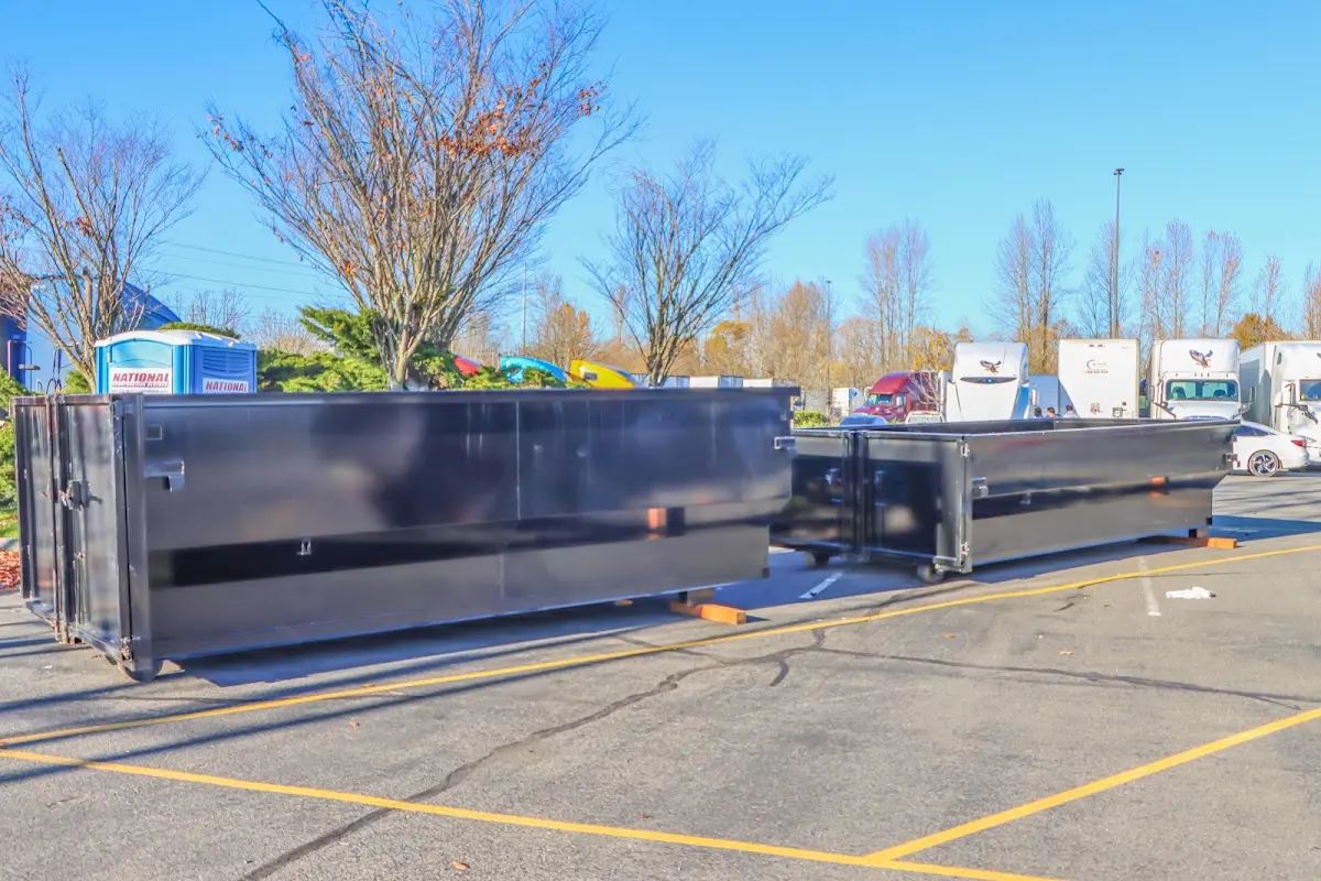 Professional dumpster rental service with roll-off container on residential driveway in Rolling Meadows